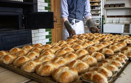 Staff at Beamish making hot cross buns for Easter.