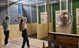 People throwing axes