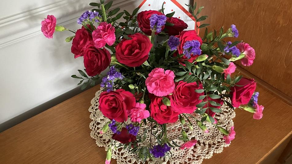 A beautiful bouquet of pink, red and purple flowers.