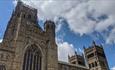 Exterior view of Durham Cathedral tower on a sunny day.