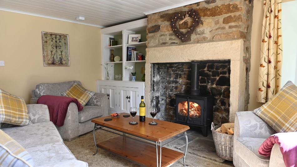 Cosy lounge ideal to sit and relax in front of log burner with a bottle of wine.