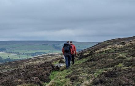 Two people walking on the moors
