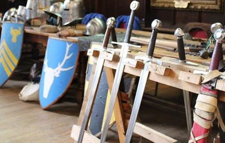 Vanguard Re-enactment Group in the Great Hall of Durham Castle.  Swords and shields.