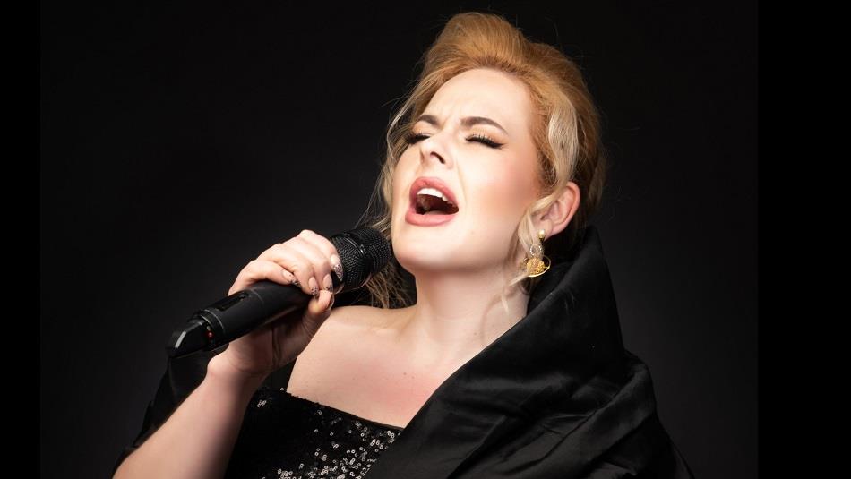 Close up photo of Natalie Black as Adele singing.