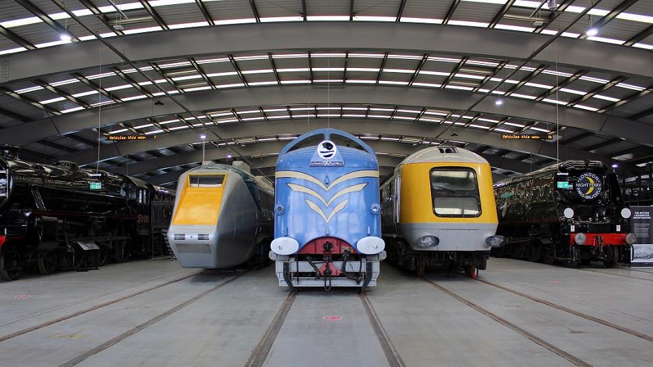 Locomotives at Locomotion, one blue, two yellow and grey  Image copyright - The Board of Trustees of the Science Museum Group