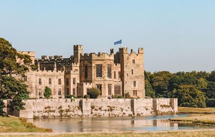 Raby Castle with lake, blue skies
