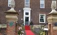 Manor House outside image
Red carpet