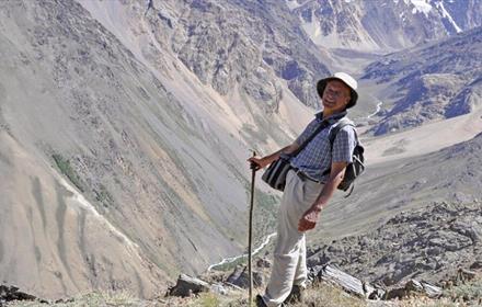 Photo of John Pilkington on The Silk Road (view of mountains).
