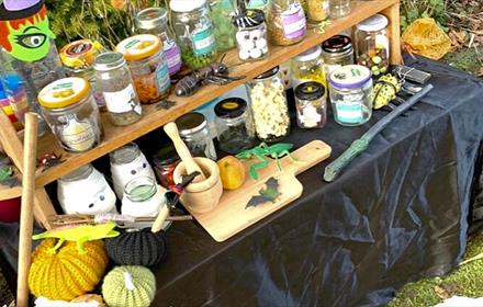 Jars of ingredients and knitted pumpkins