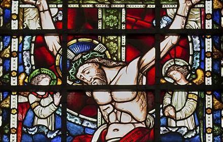 A stained glass window showing Jesus' crucifixion