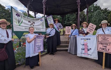 Staff and volunteers in costume during a Suffragette rally at Beamish Museum