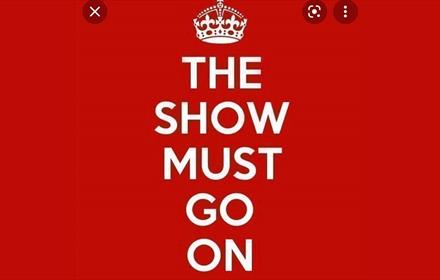 The Show Must Go On in white letters on a red background.