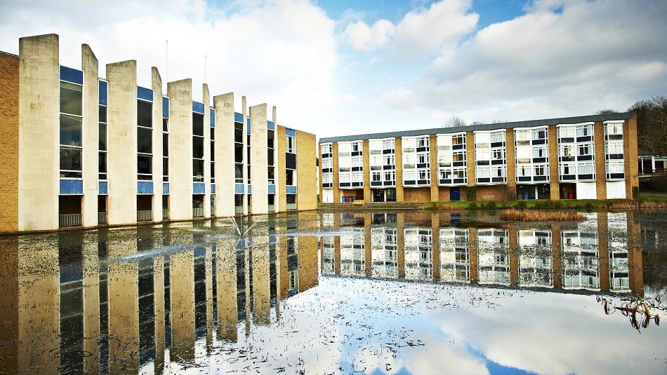 View of the exterior of Van Mildert College with lake to foreground.
