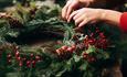 Someone making a Christmas Wreath