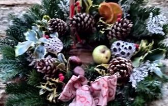 Wreath with holly, pine cones and fruit from Lowfield Gardens at last year's Barnard Castle Farmers' December Market.