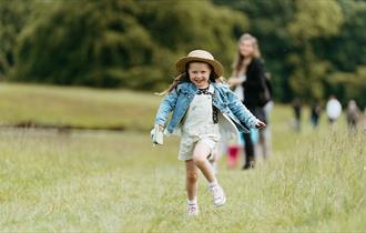 Small girl running in a field