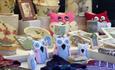 A selection of items to buy at the Weardale Show. Handmade fabric owls, pottery and pictures.