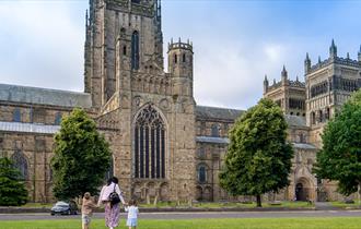 Family walking up to Durham Cathedral