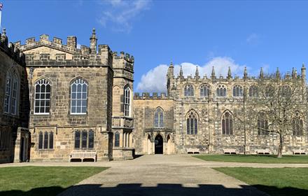 Image of Auckland Castle exterior on a sunny day.