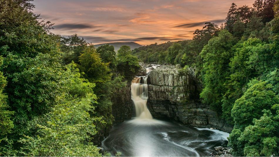 View of High Force Waterfall during sunset