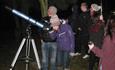 People looking through a telescope