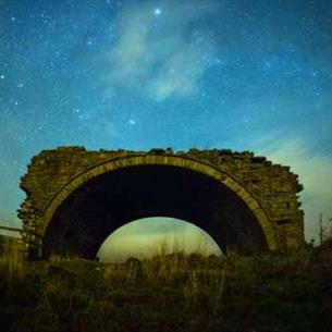 An arch at night