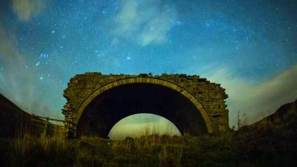 An arch at night