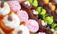 Image of a selection of treats with colourful icing on top.