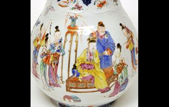 Beautiful artwork on pots depicting scenes from Hong Kong.