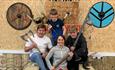 Family sat on throne at Valhalla North Axe Throwing