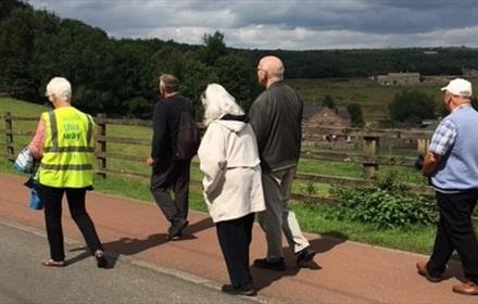 Image of people enjoying a walk in the countryside.