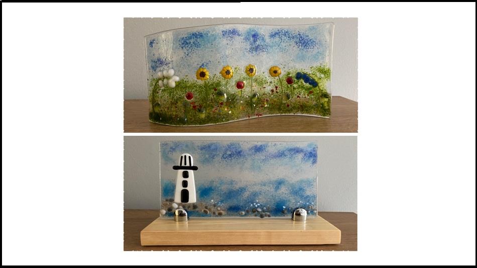 two examples of fused glasswork.  One, a coastal picture with lighthouse and one a field of flowers, including sunflowers