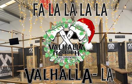 Interior image of Valhalla North 2 axes surrounded by wreath and santa hat