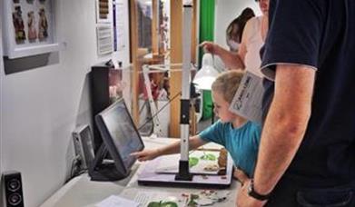 Child interacting at exhibition celebrating 70 years of children's television