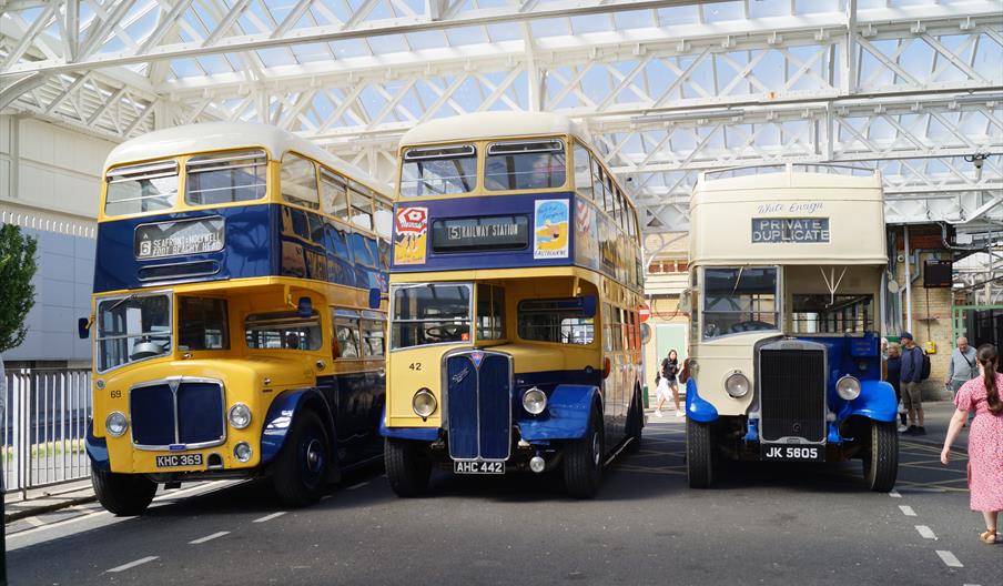 A line up of old Eastbourne corporation vehicles at Eastbourne Station