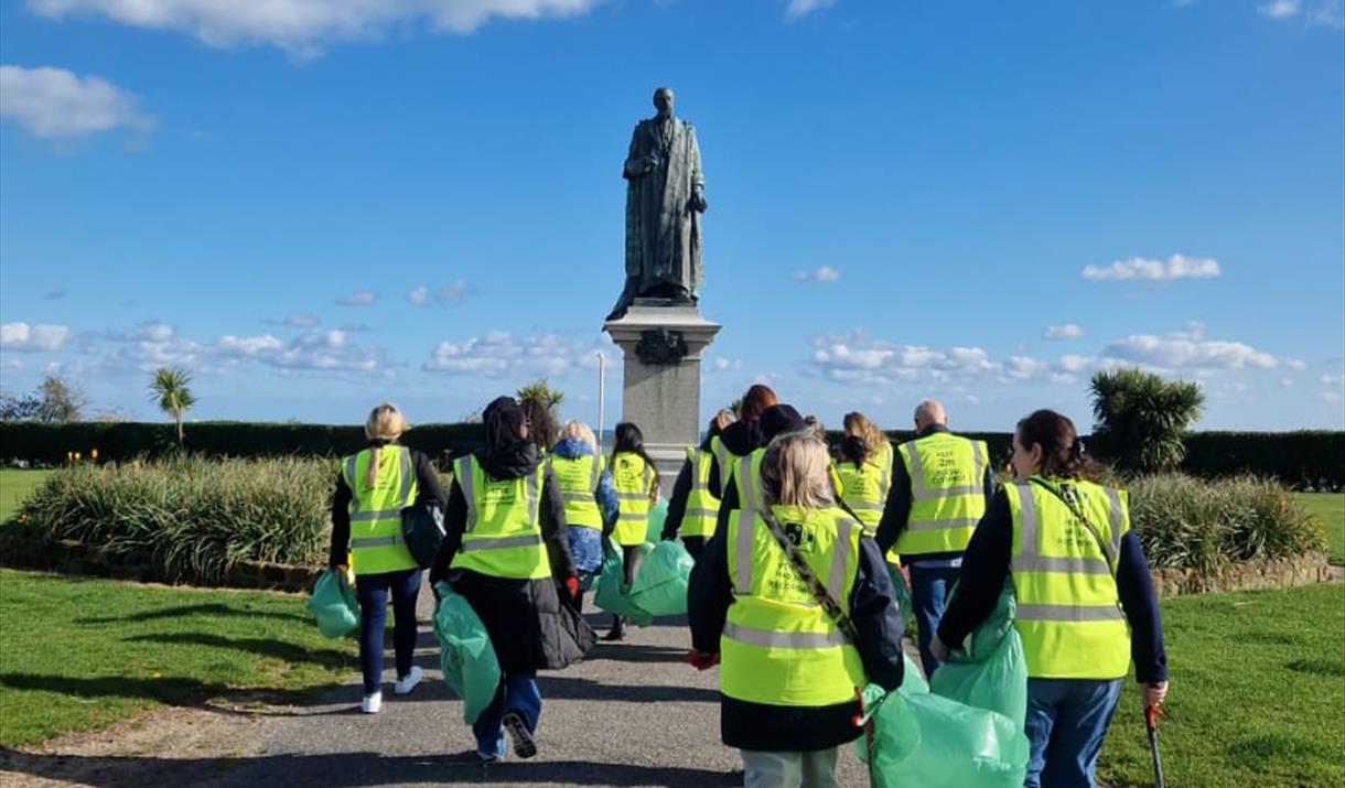 Guests in High Vis Cleaning the Beach