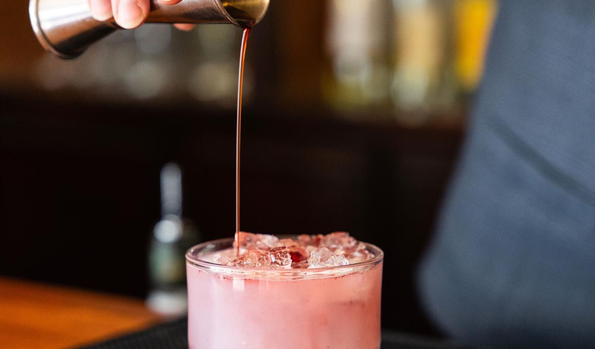 Bartender Pouring a Cocktail