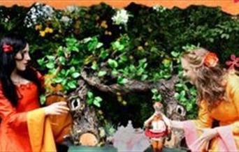 Puppeteers performing a woodland puppet show