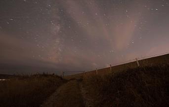 View of a Downland path underneath starry sky