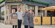 Four members of staff standing outside of the Pizza Express restaurant