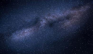 Dark sky with stars from the milky way at the centre