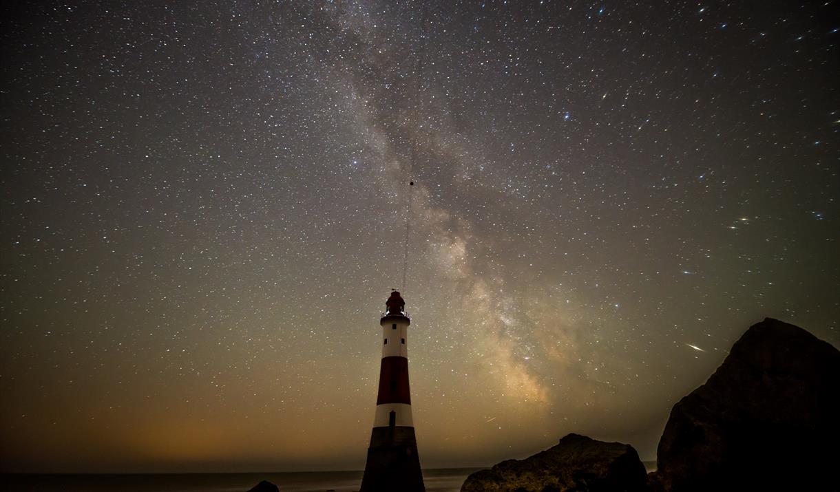 Beachy Head Lighthouse at night with starry sky