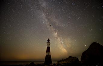 Beachy Head Lighthouse at night with starry sky