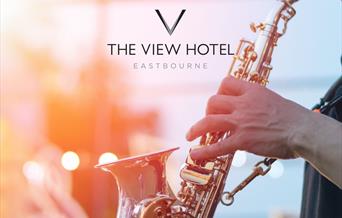 Close up of a saxophone being played with The View Hotel logo overlaid
