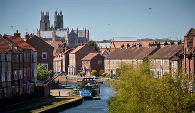 Looking between houses towards the Minster and Beverley Beck in East Yorkshire.