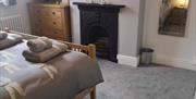 The double room with feature fireplace at Dragonfly Cottage in East Yorkshire.