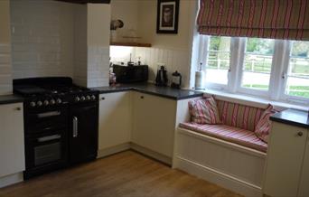 The kitchen with snug seating fitted underneath the kitchen window at Stacey Cottage in East Yorkshire.