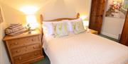A bedroom with a double bed at Drewton cottages in East Yorkshire.