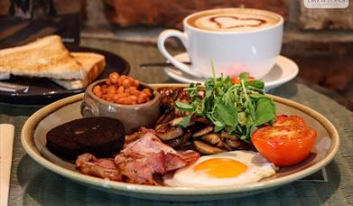 A plate of full English breakfast with toast and a cappuccino, Drewton's Eastate, East Yorkshire