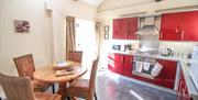 The kitchen area with dining table at  Drewton cottages in East Yorkshire.